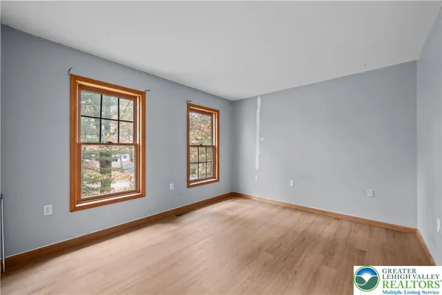 a view of an empty room with windows