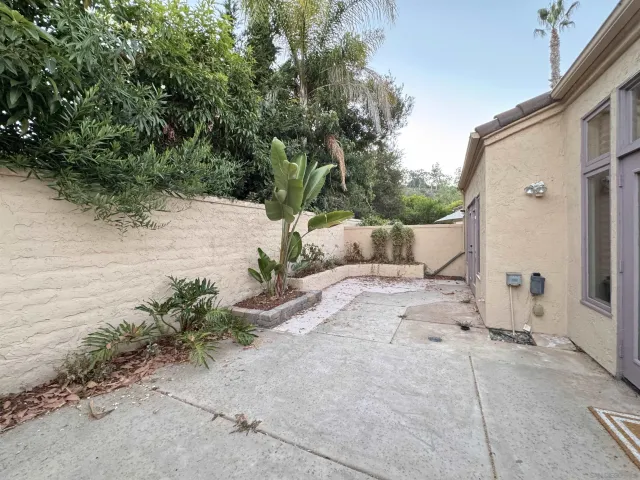 a view of a yard with a patio