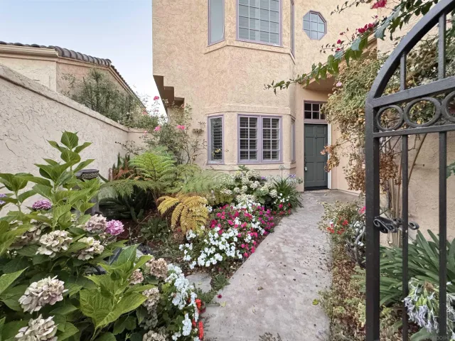 a flower plants sitting in front of a building