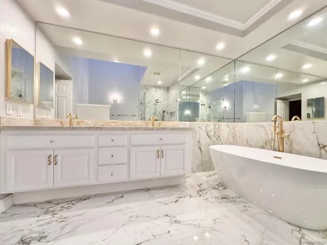 a large bathroom with a lot of counter space and a sink