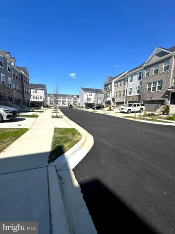 a view of a swimming pool with outdoor seating and a buildings view