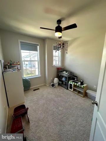 a room with furniture and a window