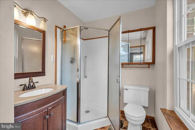 a spacious bedroom with a large bed and a window