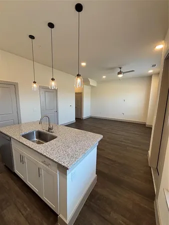 a kitchen with a sink and stove