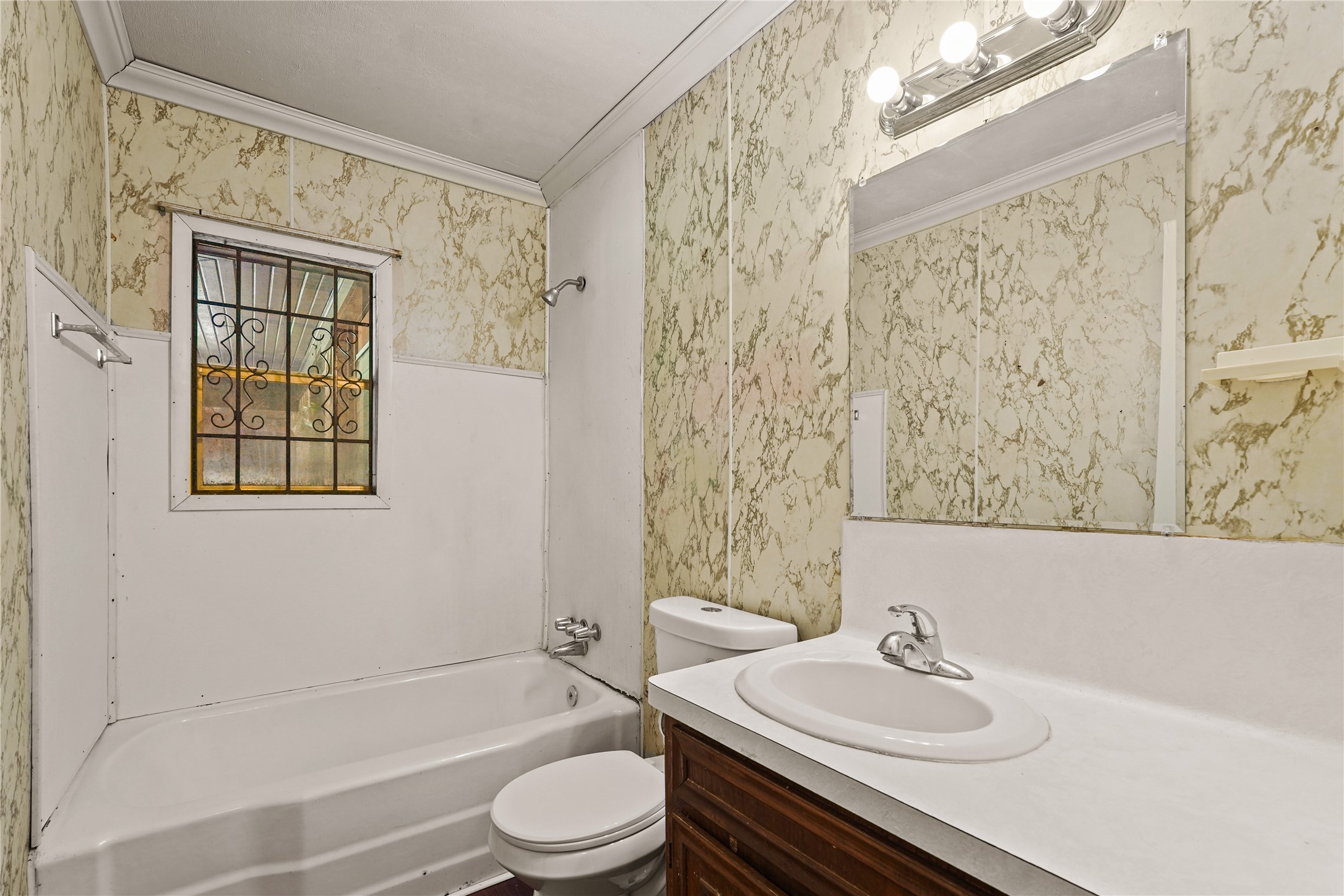 2315 Leffingwell Street Houston, TX 77026 - Photo 11 of 17 a bathroom with a sink toilet a mirror and shower