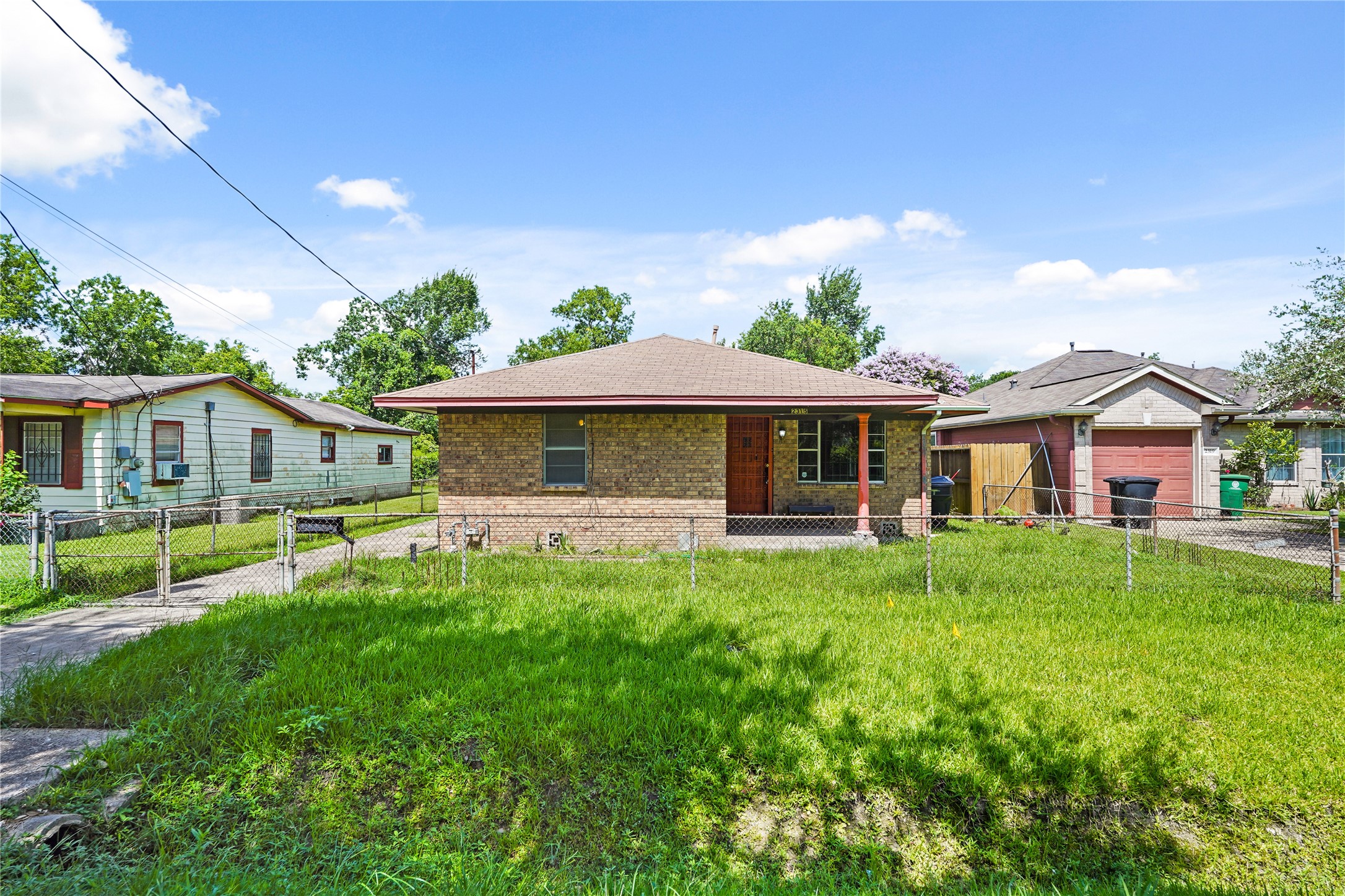 2315 Leffingwell Street Houston, TX 77026 - Photo 17 of 17 a front view of a house with a garden and porch