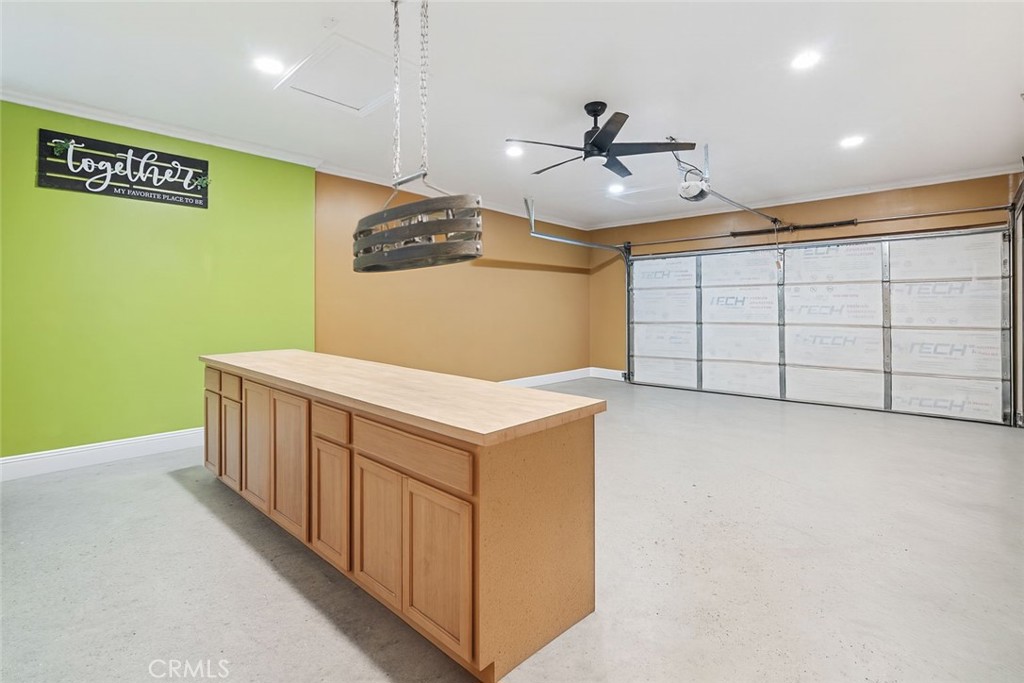 255 West Valencia Street Rialto, CA 92376 - Photo 15 of 34 a kitchen with stainless steel appliances cabinets and wooden floor