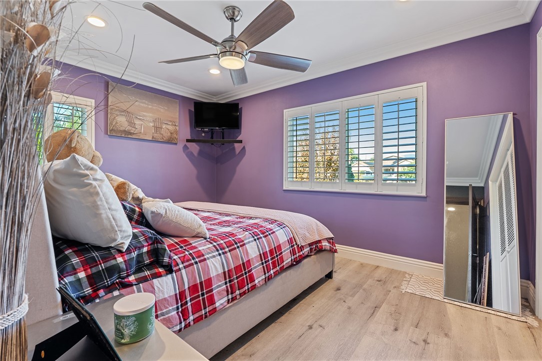 255 West Valencia Street Rialto, CA 92376 - Photo 17 of 34 a bedroom with a bed and a chandelier