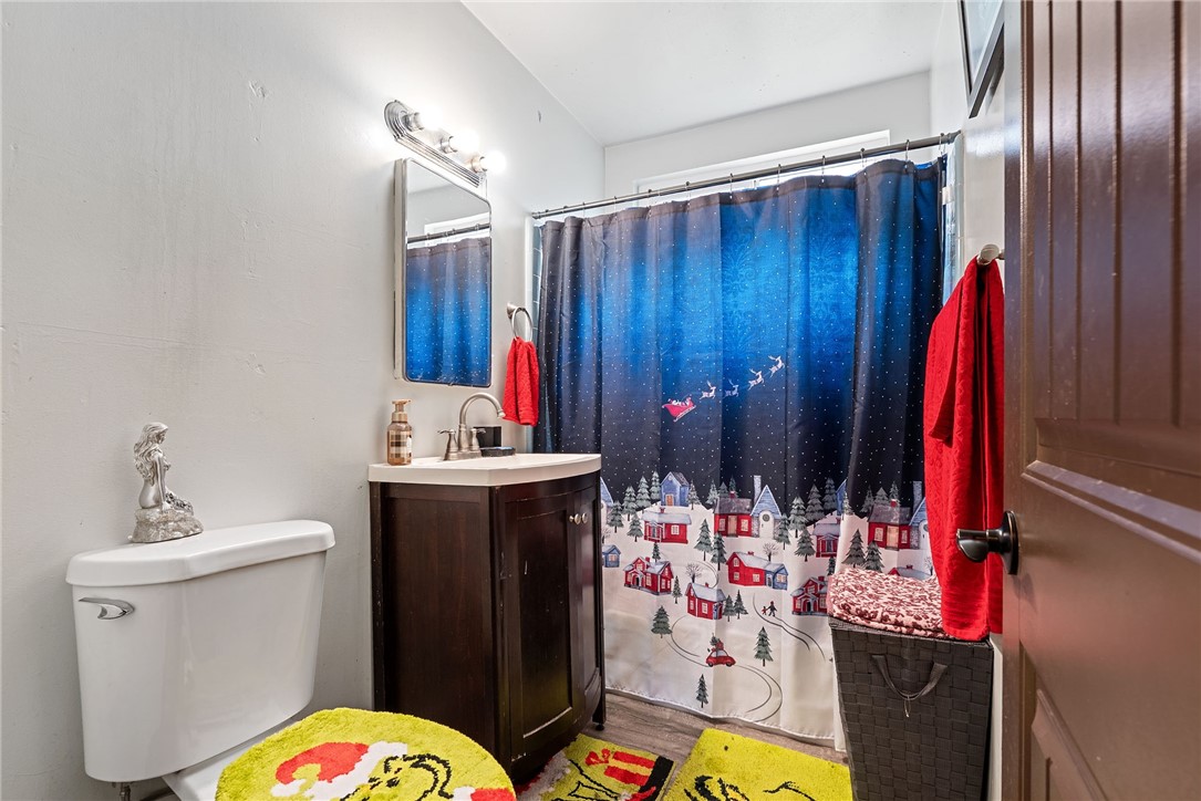 255 West Valencia Street Rialto, CA 92376 - Photo 19 of 34 a bathroom with a sink and a mirror