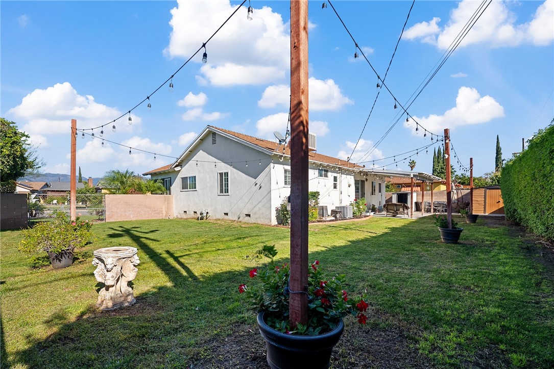 255 West Valencia Street Rialto, CA 92376 - Photo 24 of 34 a front view of a house with garden