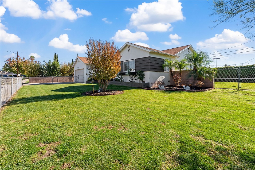 255 West Valencia Street Rialto, CA 92376 - Photo 25 of 34 a view of a house with a yard and sitting area