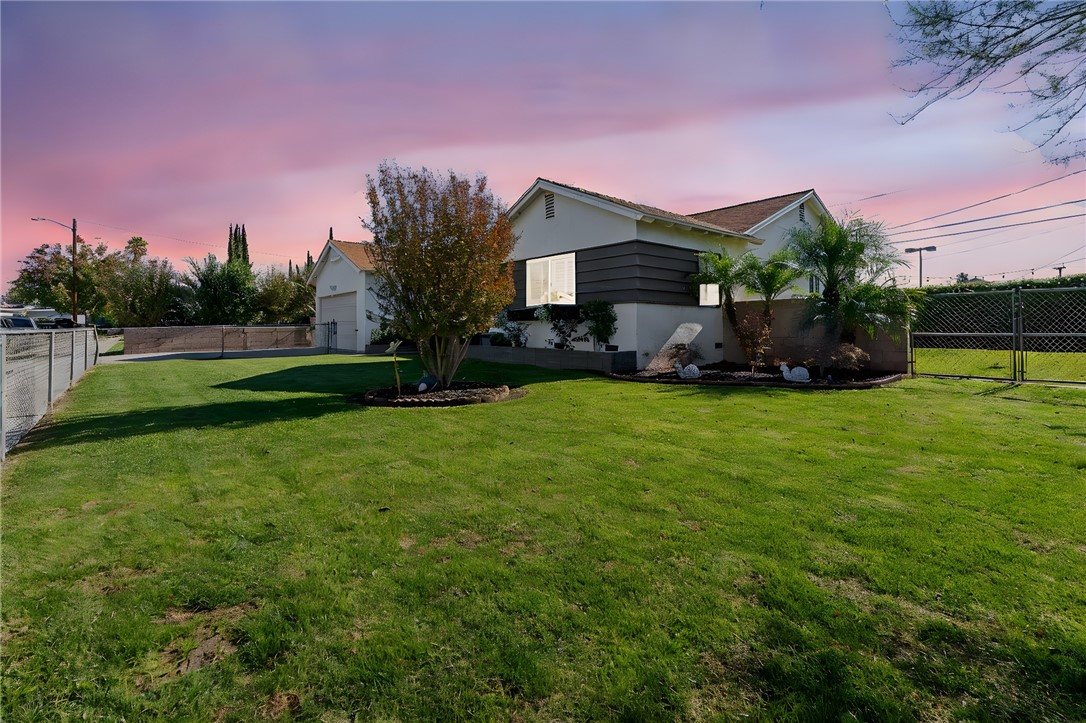 255 West Valencia Street Rialto, CA 92376 - Photo 29 of 34 a front view of a house with garden