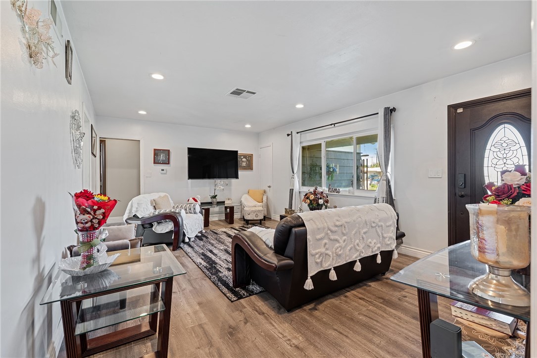 255 West Valencia Street Rialto, CA 92376 - Photo 6 of 34 a living room with furniture and a flat screen tv