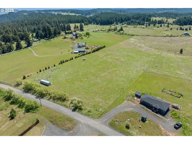 a view of a large building with a yard