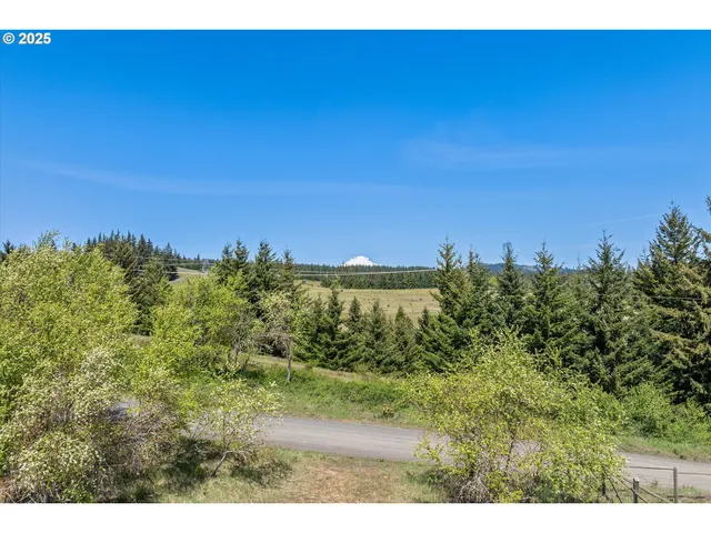 a view of a lake with a yard
