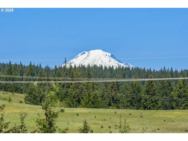 a view of a lake with houses in the back