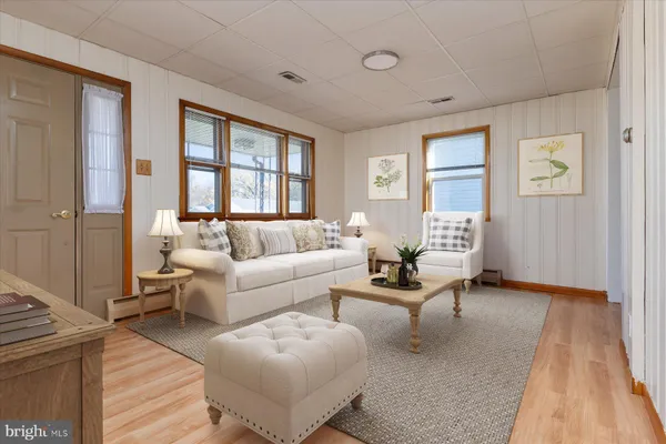 a living room with furniture and a window