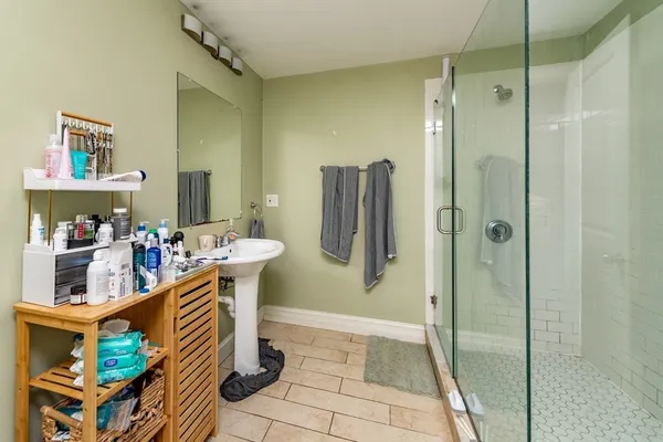 a bathroom with a tub and a shower