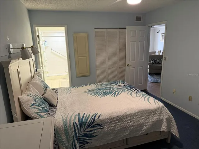 a bedroom with a bed and furniture