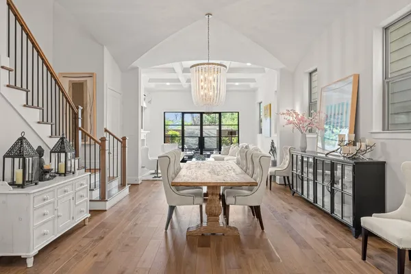 a spacious bedroom with a bed and a chair