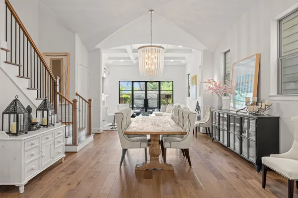 a view of a dining room with furniture window and wooden floor