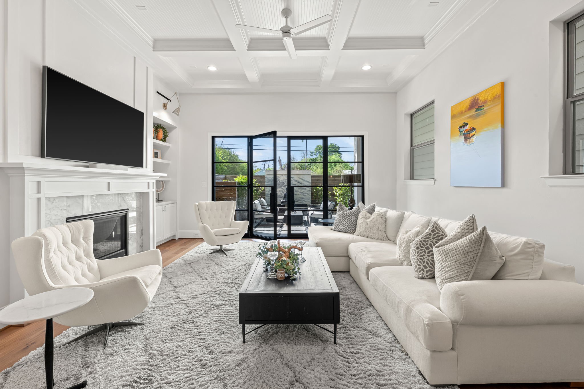 110 East 26th Street, Unit B Houston, TX 77008 - Photo 13 of 43 Impactful steel doors and exquisite ceiling details anchor the home, creating a seamless flow into a nature-filled outdoor oasis—craftsmanship rarely found at this price point in the Heights.