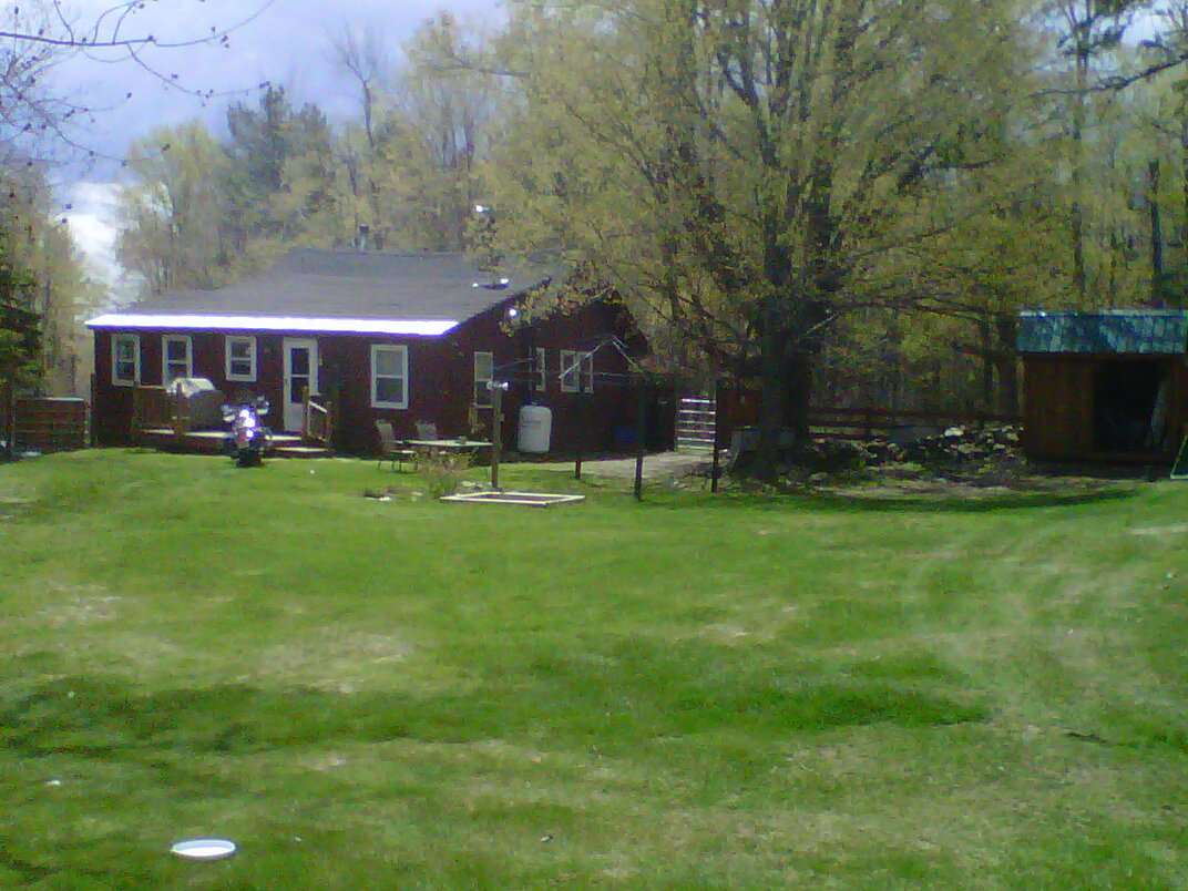 826 Shaw Road Windsor, MA 01270 - Photo 1 of 32 a view of a house with a yard and sitting area
