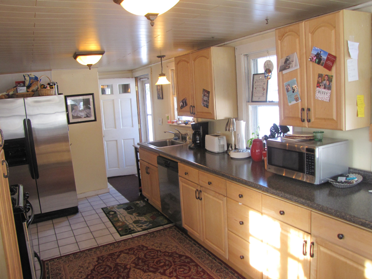826 Shaw Road Windsor, MA 01270 - Photo 12 of 32 a kitchen with stainless steel appliances a sink a stove a refrigerator and cabinets