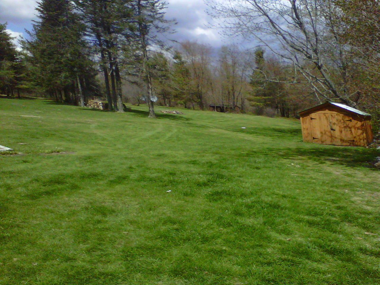 826 Shaw Road Windsor, MA 01270 - Photo 27 of 32 a backyard of a house with lots of green space and fountain