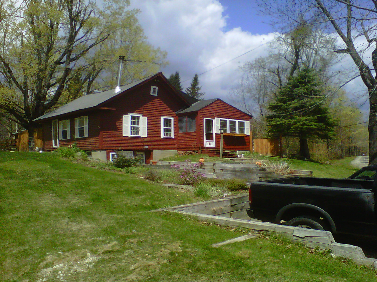 826 Shaw Road Windsor, MA 01270 - Photo 30 of 32 a front view of a house with a yard