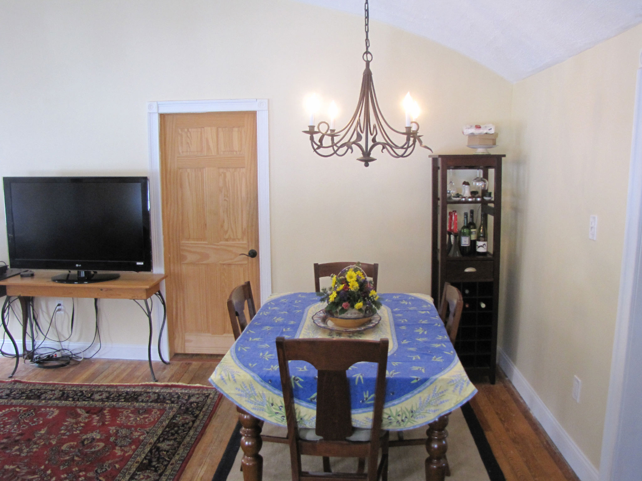826 Shaw Road Windsor, MA 01270 - Photo 6 of 32 a view of a dining room with furniture wooden floor and a chandelier