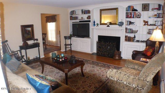 309 Biltmore Road Louisville, KY 40207 - Photo 3 of 20 Living room with fireplace with bookcases and hardwood floors