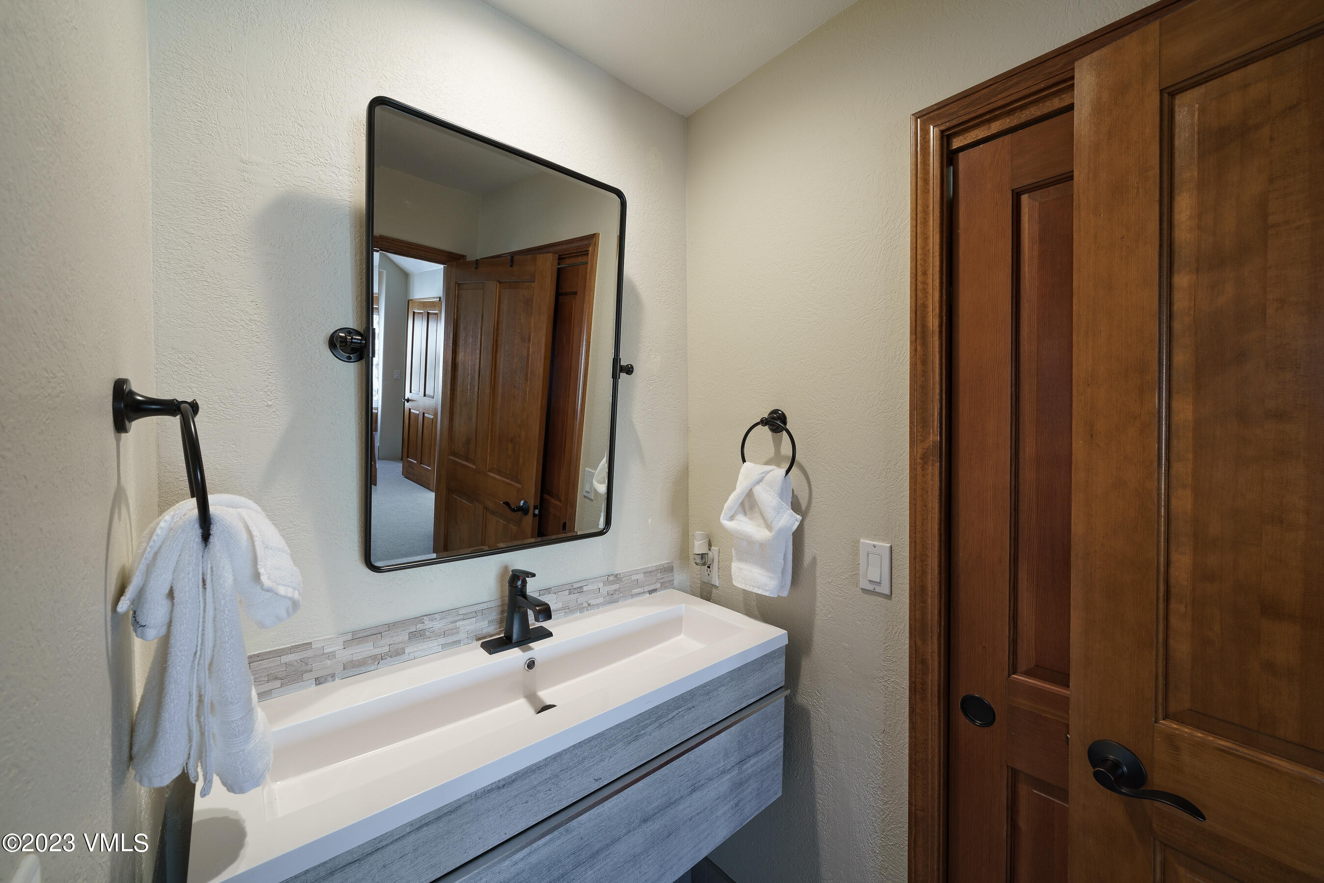 176 Windermere Circle Edwards, CO 81632 - Photo 22 of 42 a bathroom with a sink vanity and mirror