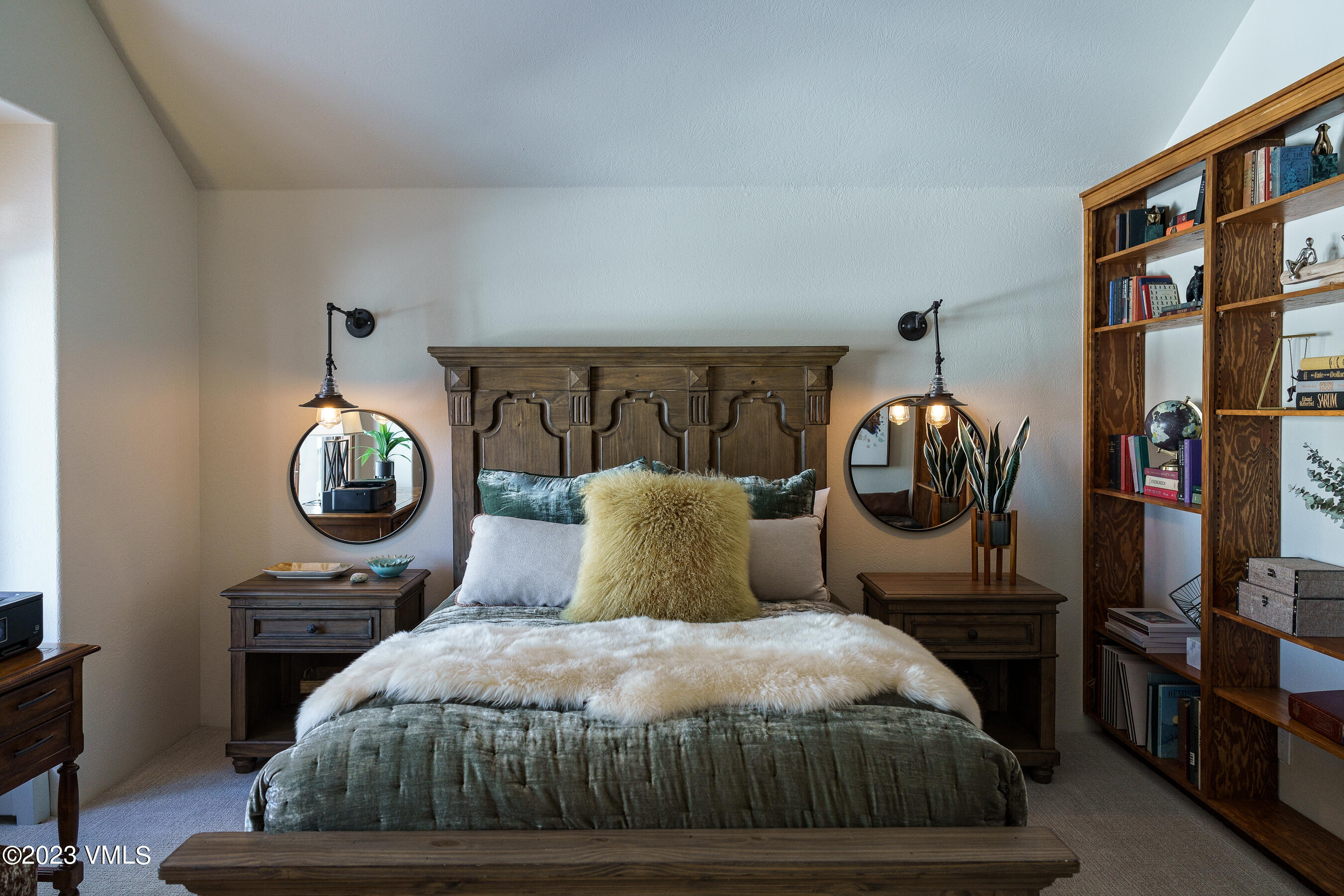 176 Windermere Circle Edwards, CO 81632 - Photo 24 of 42 a bedroom with a bed and a mirror