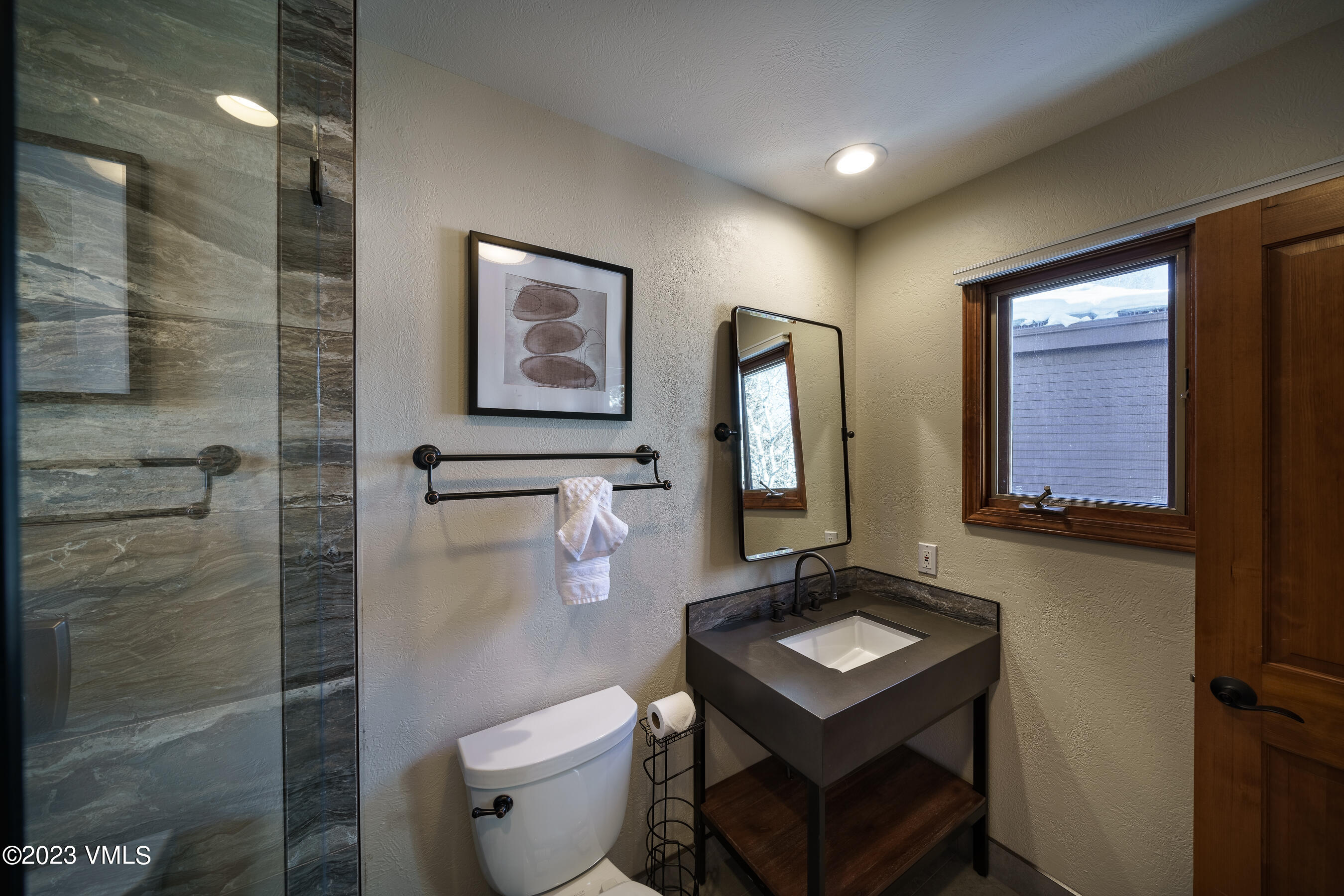 176 Windermere Circle Edwards, CO 81632 - Photo 27 of 42 a bathroom with a toilet sink and mirror