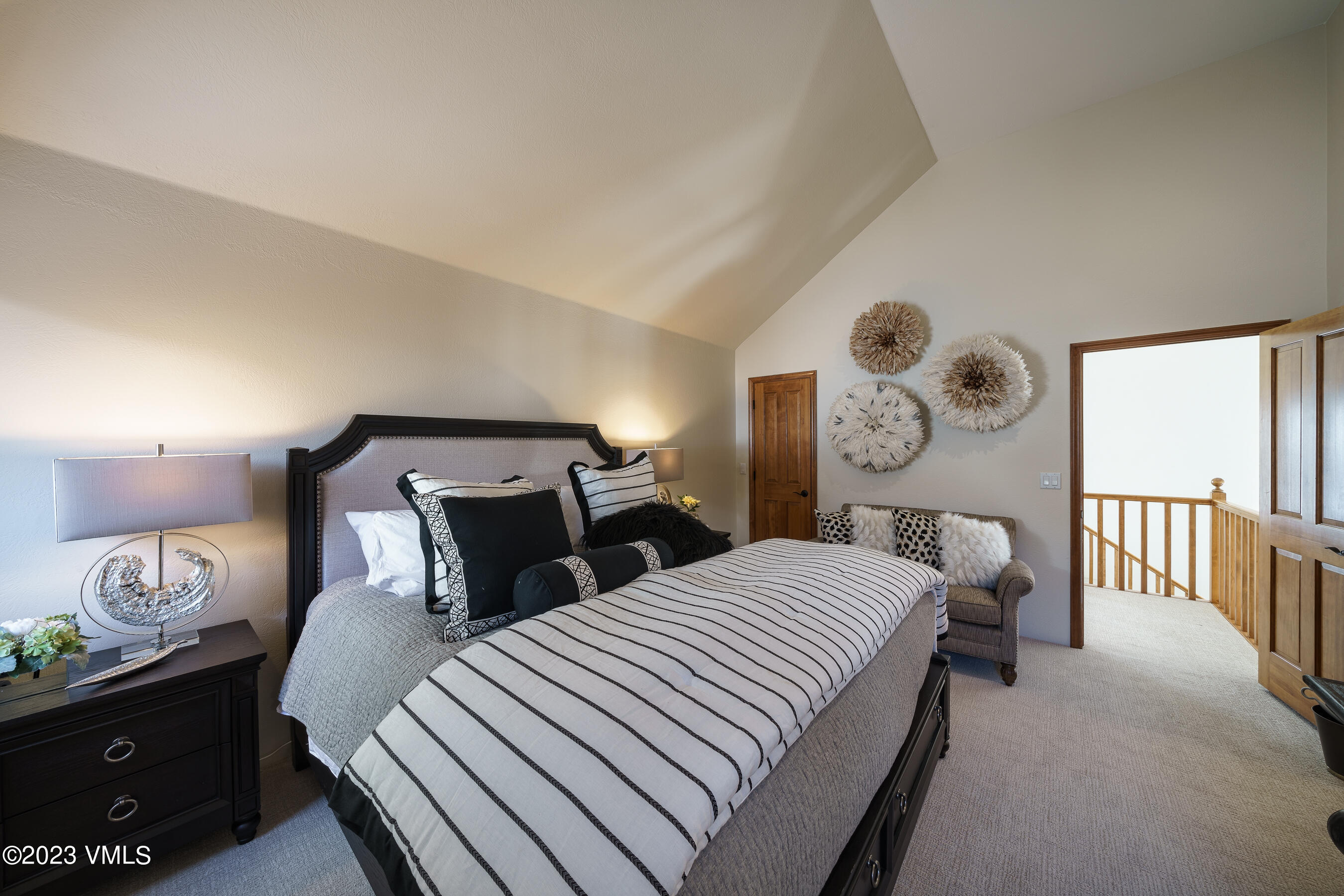 176 Windermere Circle Edwards, CO 81632 - Photo 33 of 42 a bedroom with a bed and a lamp on dresser
