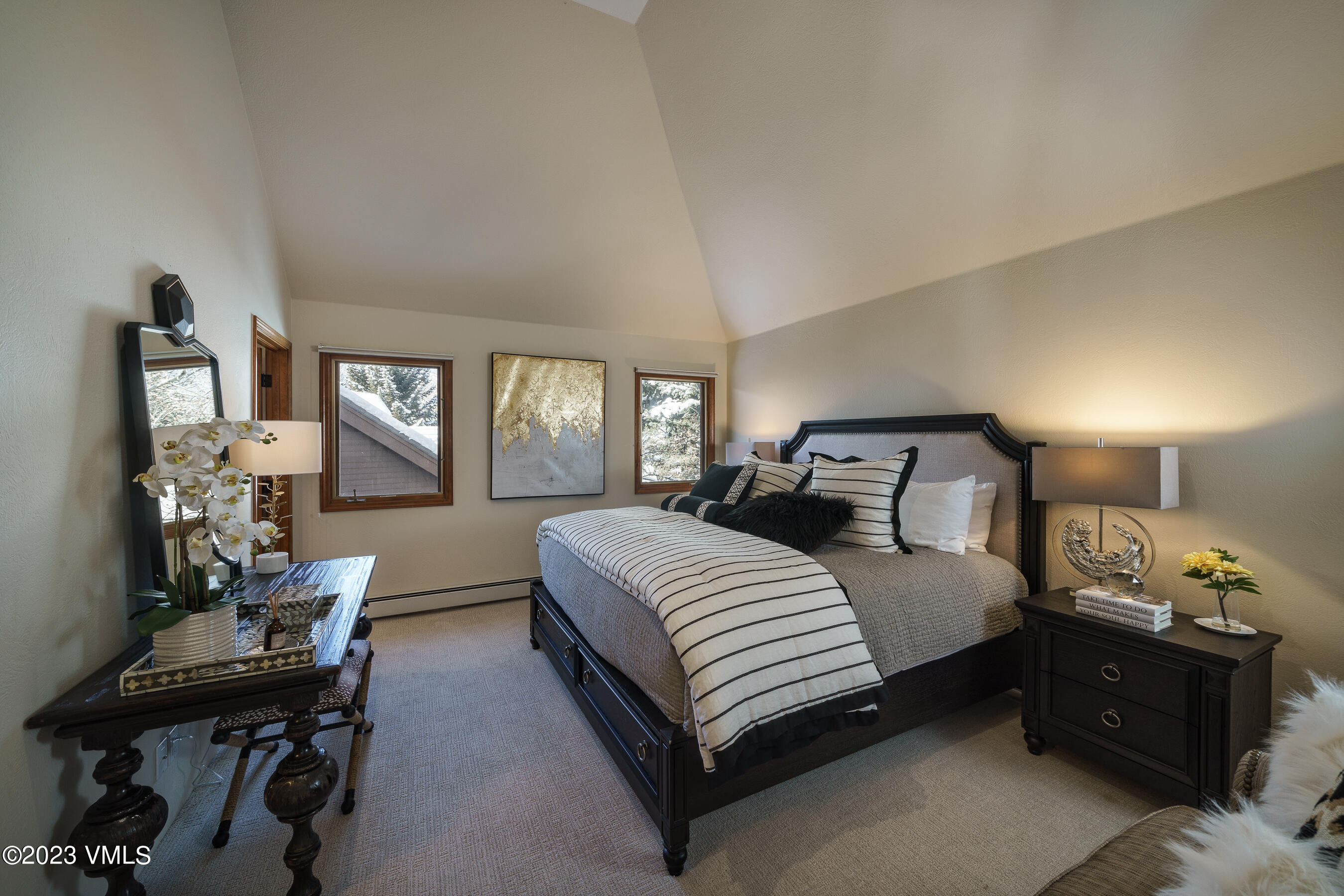 176 Windermere Circle Edwards, CO 81632 - Photo 34 of 42 a bedroom with a bed and a table in it
