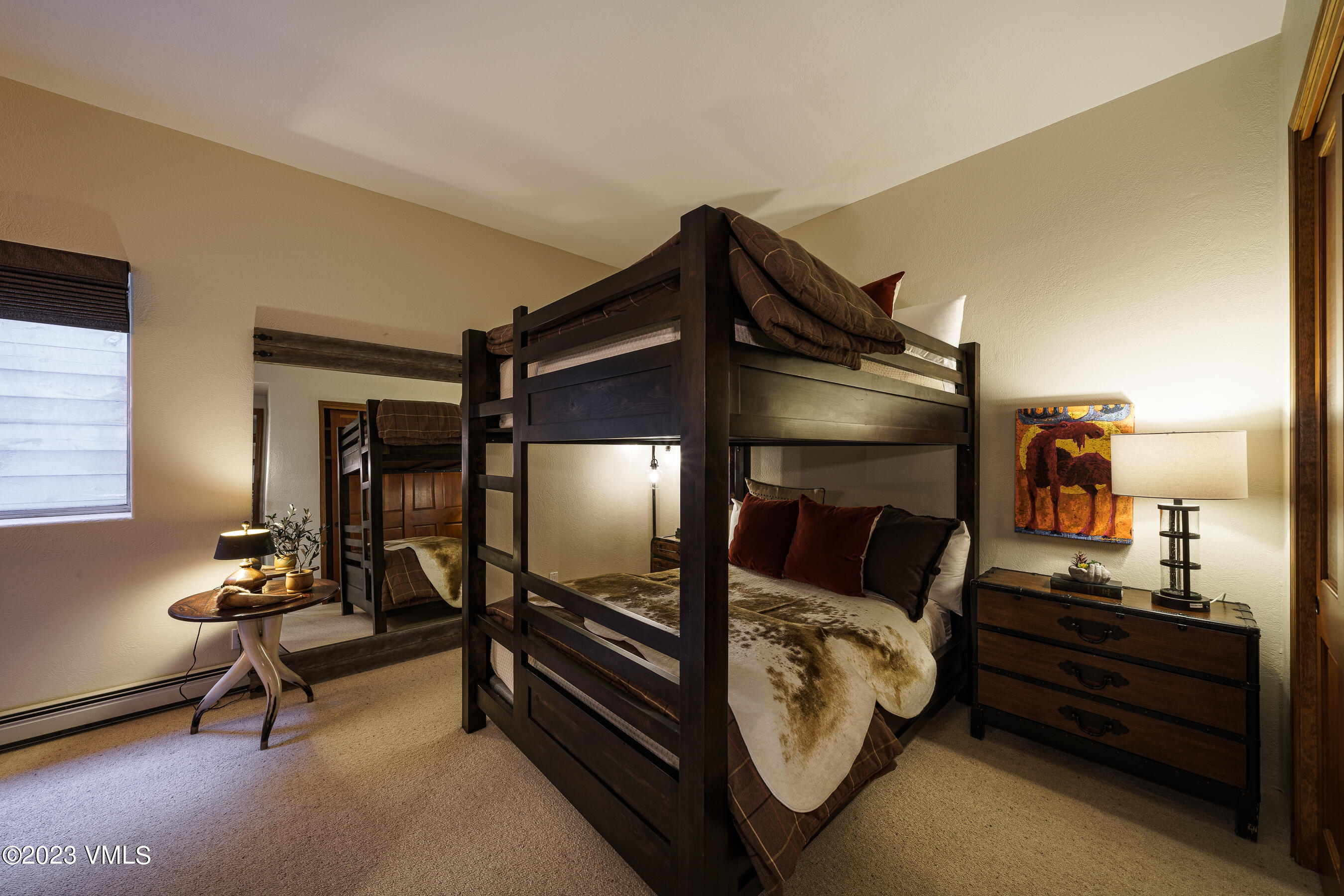 176 Windermere Circle Edwards, CO 81632 - Photo 41 of 42 a bedroom with furniture and a mirror