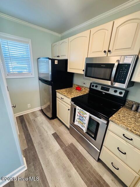 650 Cedar Point Boulevard, Unit B11 Cedar Point, NC 28584 - Photo 6 of 53 Galley kichen with a pantry
