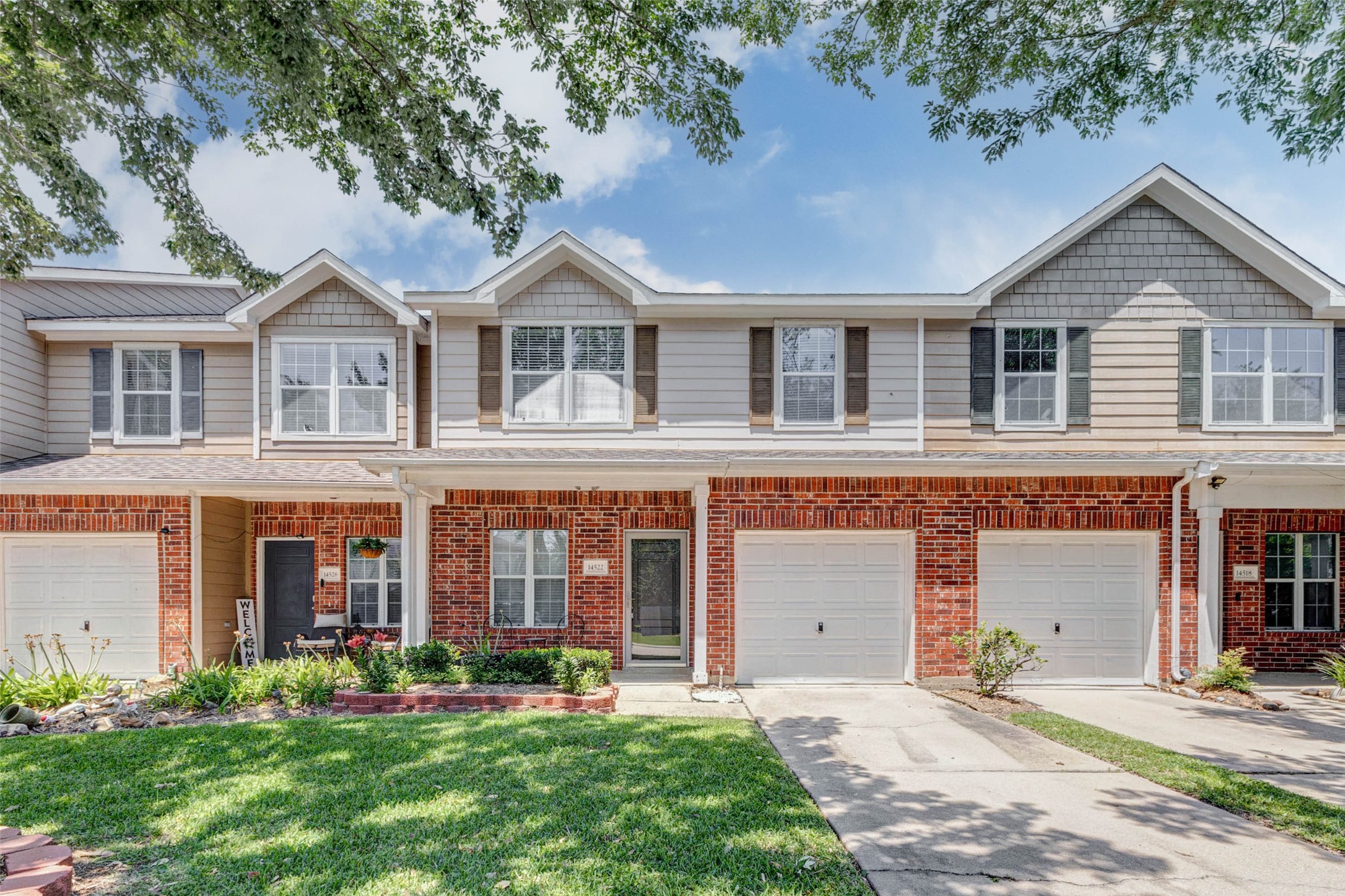14522 Durham Chase Lane Houston, TX 77095 - Photo 1 of 40 front view of a brick house with a yard