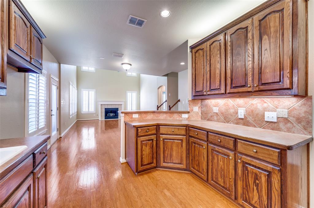 3912 Sovereign Drive Bedford, TX 76021 - Photo 12 of 34 Kitchen featuring Solid Wood Floors