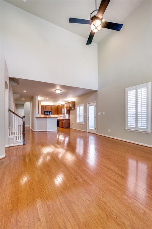 3912 Sovereign Drive Bedford, TX 76021 - Photo 14 of 34 Large Greatroom with Soaring Ceilings and Solid Wood Floors