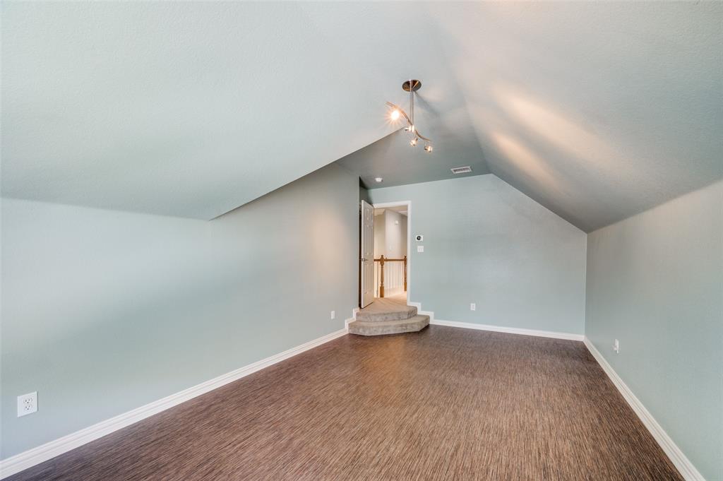 3912 Sovereign Drive Bedford, TX 76021 - Photo 25 of 34 Bonus room featuring lofted ceiling and dark wood finished floors