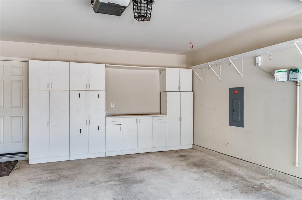 3912 Sovereign Drive Bedford, TX 76021 - Photo 26 of 34 Garage featuring electric panel and extra storage