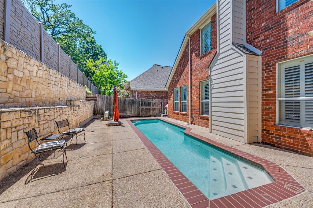 3912 Sovereign Drive Bedford, TX 76021 - Photo 30 of 34 View of Lap Pool featuring a Patio and a Fenced Backyard