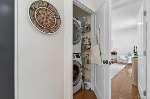 walk in closet with a mirror