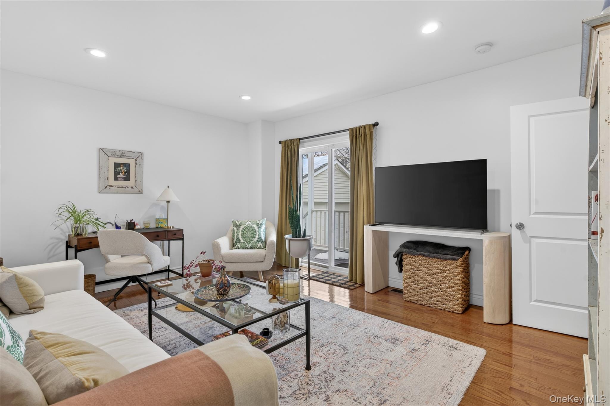 35 Kent Street Beacon, NY 12508 - Photo 21 of 42 a living room with furniture a flat screen tv and a fireplace