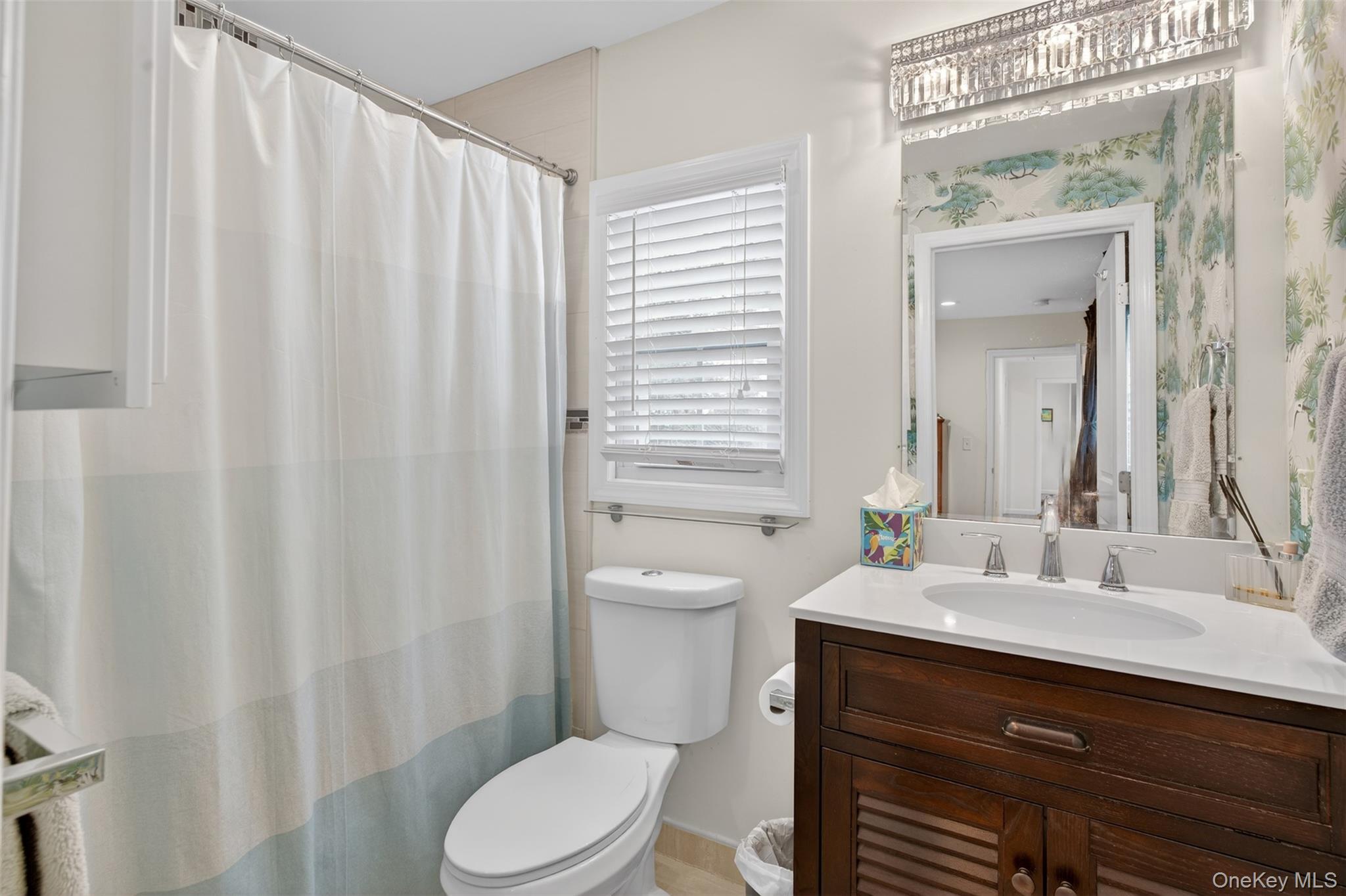 35 Kent Street Beacon, NY 12508 - Photo 30 of 42 a bathroom with a sink a toilet and shower curtain