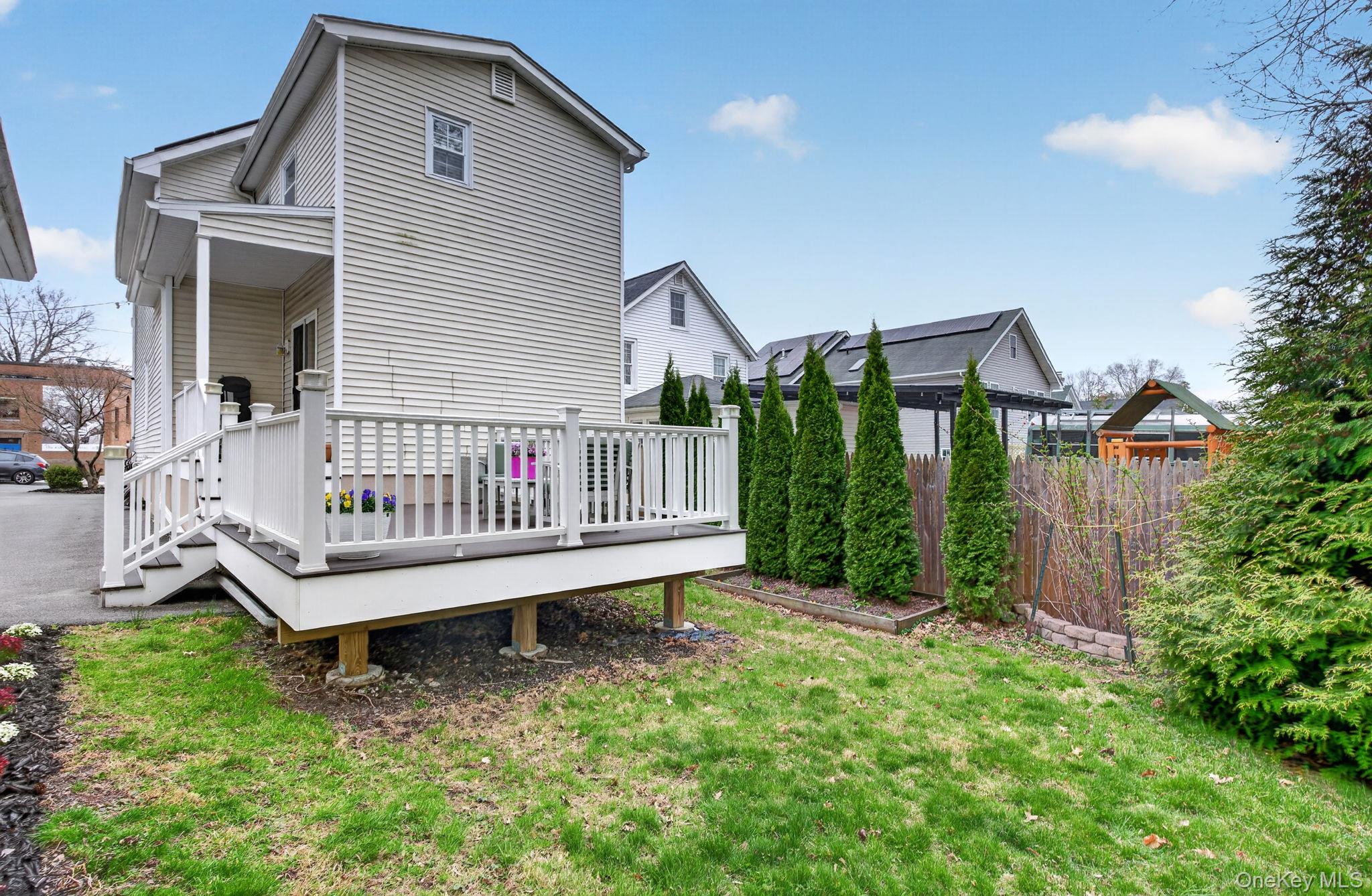 35 Kent Street Beacon, NY 12508 - Photo 36 of 42 a view of a house with a yard and deck