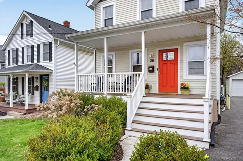 front view of a house with a yard